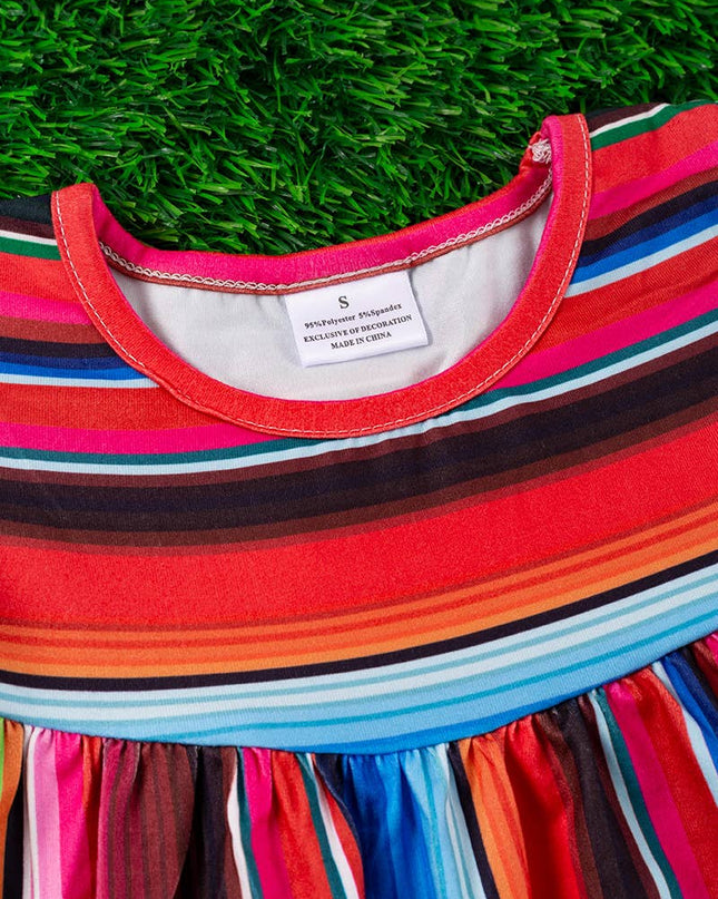 SERAPE PRINTED TUNIC WITH BLACK POM POM TRIM. TPG15113017-SO