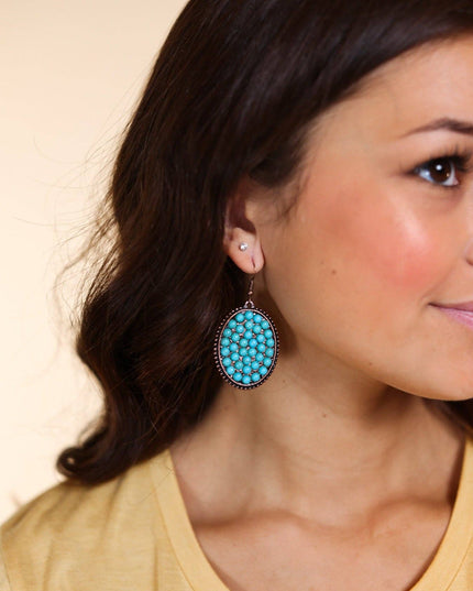 Bumpily Bamboozled Bronze Earrings With A Turquoise Pendant