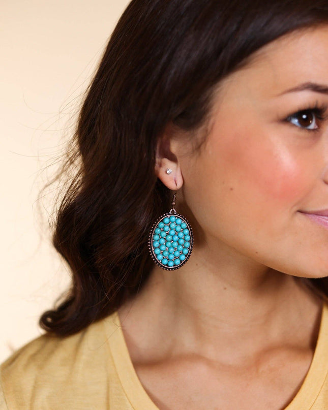 Bumpily Bamboozled Bronze Earrings With A Turquoise Pendant