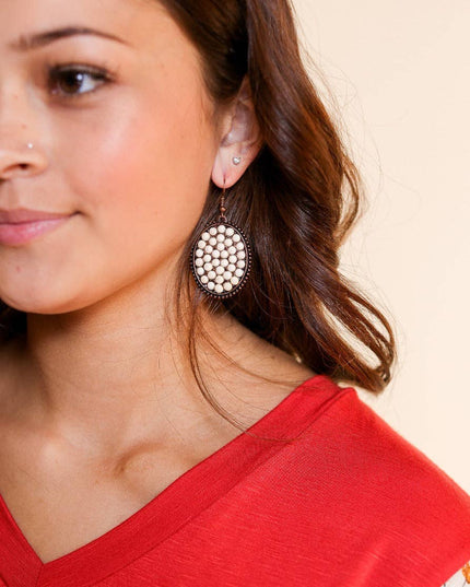 Bumpily Bamboozled Bronze Earrings With A Cream Pendant