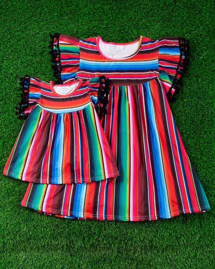 SERAPE PRINTED TUNIC WITH BLACK POM POM TRIM. TPG15113017-SO