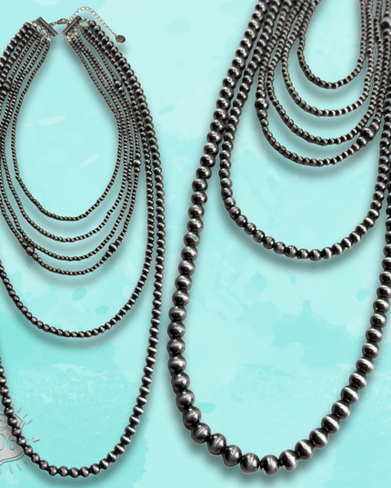 Western mixed size silver bead necklace