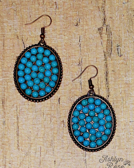 Bumpily Bamboozled Bronze Earrings With A Turquoise Pendant